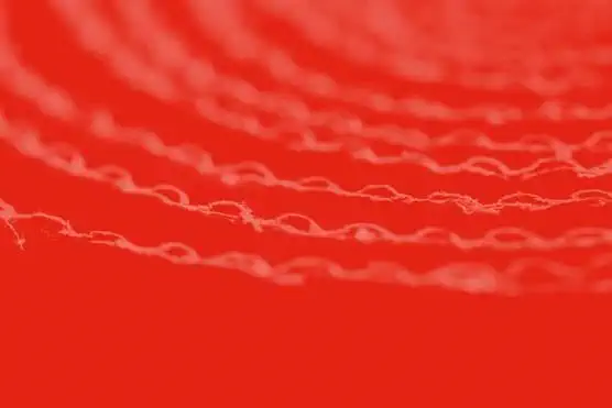 Cardboard textured background with red overlay