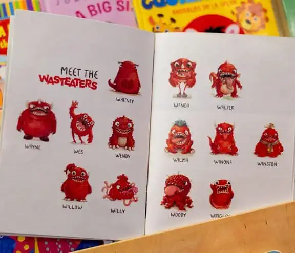 Open wasteater storybook sat on childrens bookshelf, page shown is meet the wasteaters page showing all the wasteaters
