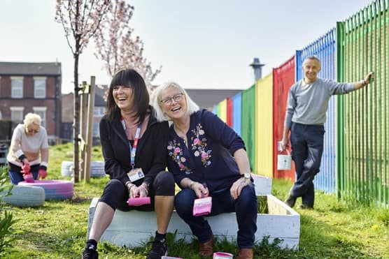 Public laughing in garden