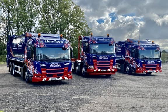 Line of Hamilton waste trucks