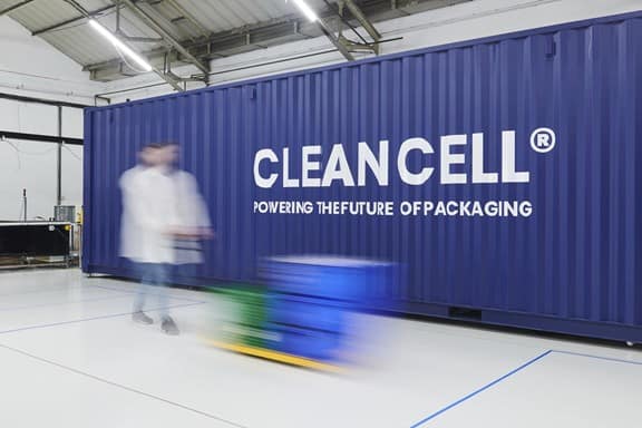 Blur of man pushing boxes in facility