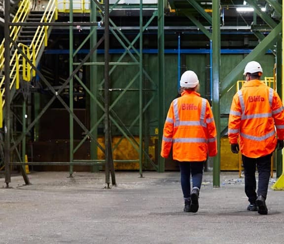 Back of two employees with Biffa high vis