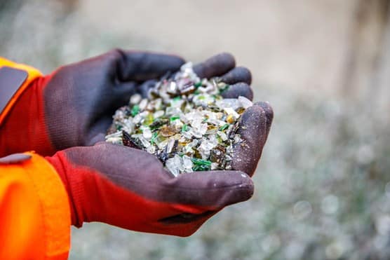 Man holding recycled glass