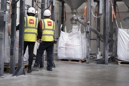 Biffa staff loading polypropylene sacks at recycling commodities facility