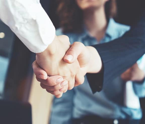 business people shaking hands in the office
